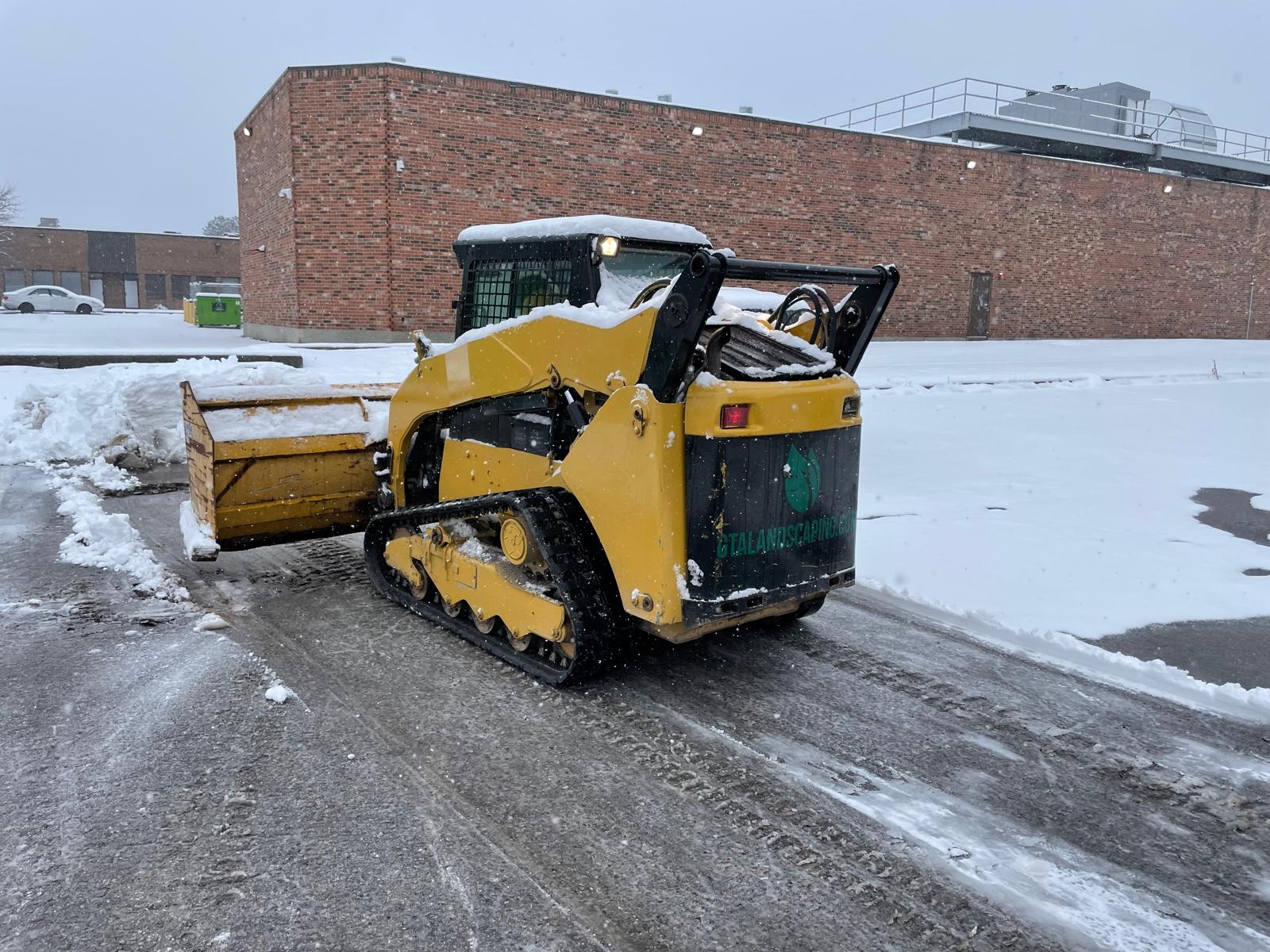 Commercial snow removal service in Toronto industrial parking lot